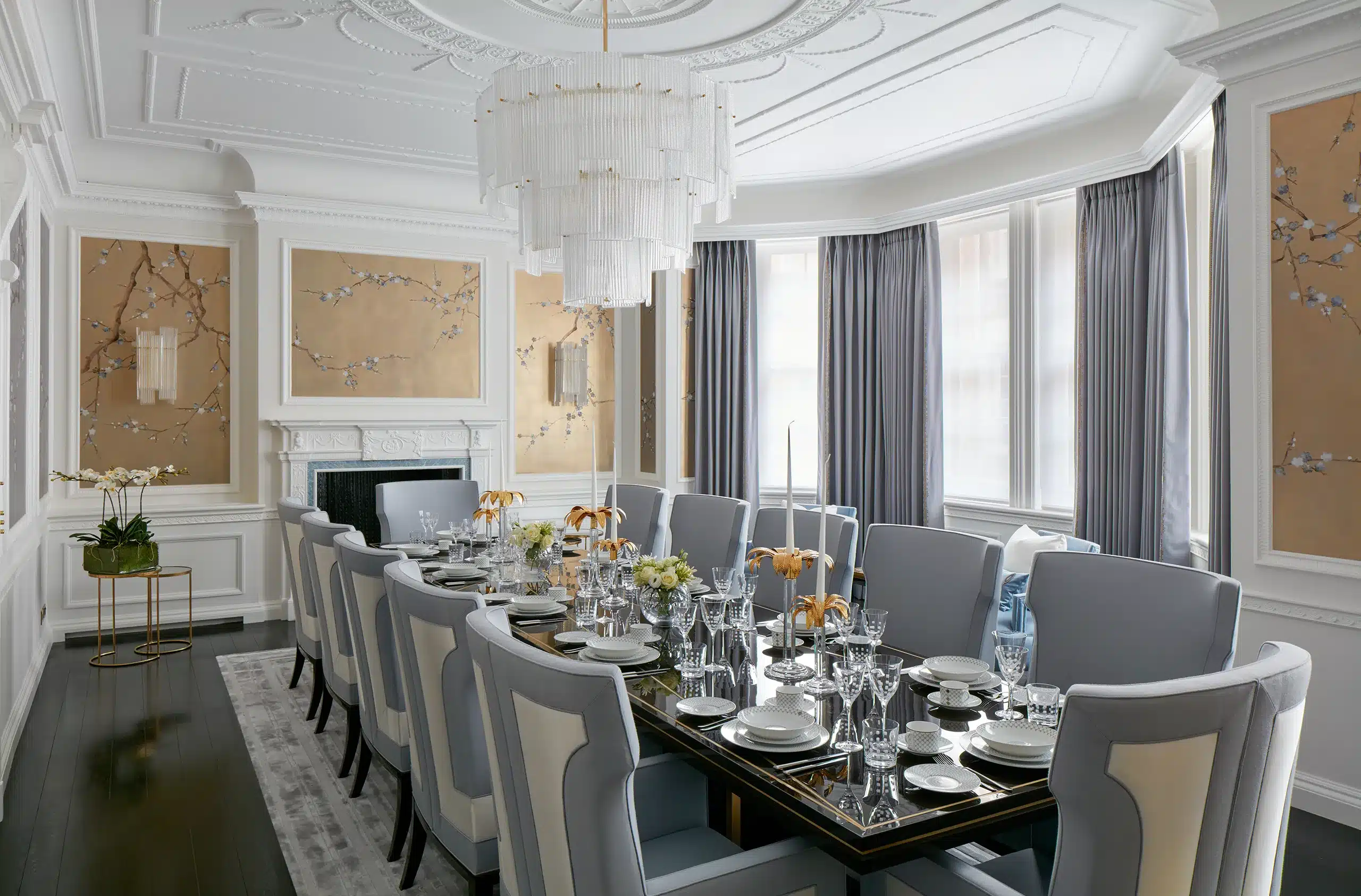 Long view of a dining room as designed by Katharine Pooley and her team in London