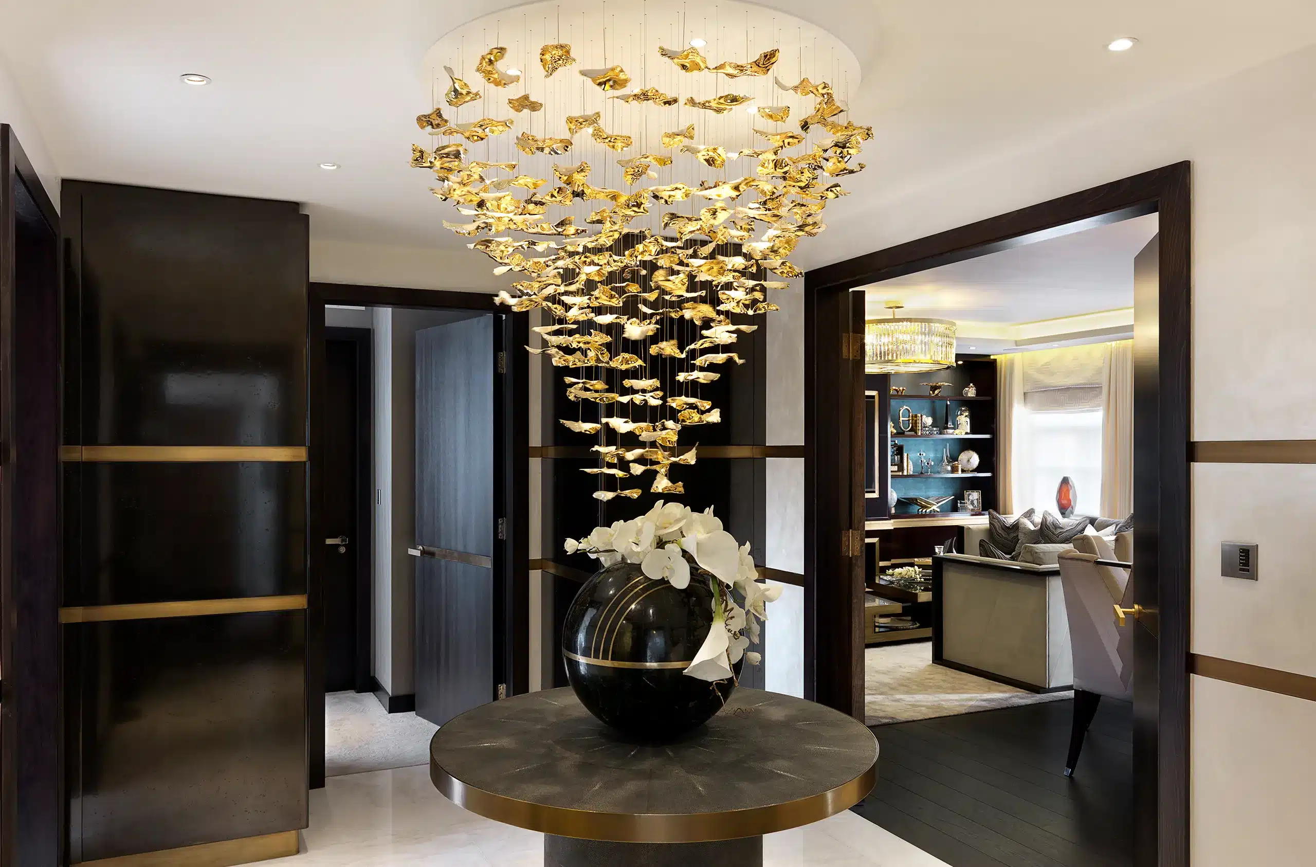 A entryway in a central london apartment with a luxurious chandelier