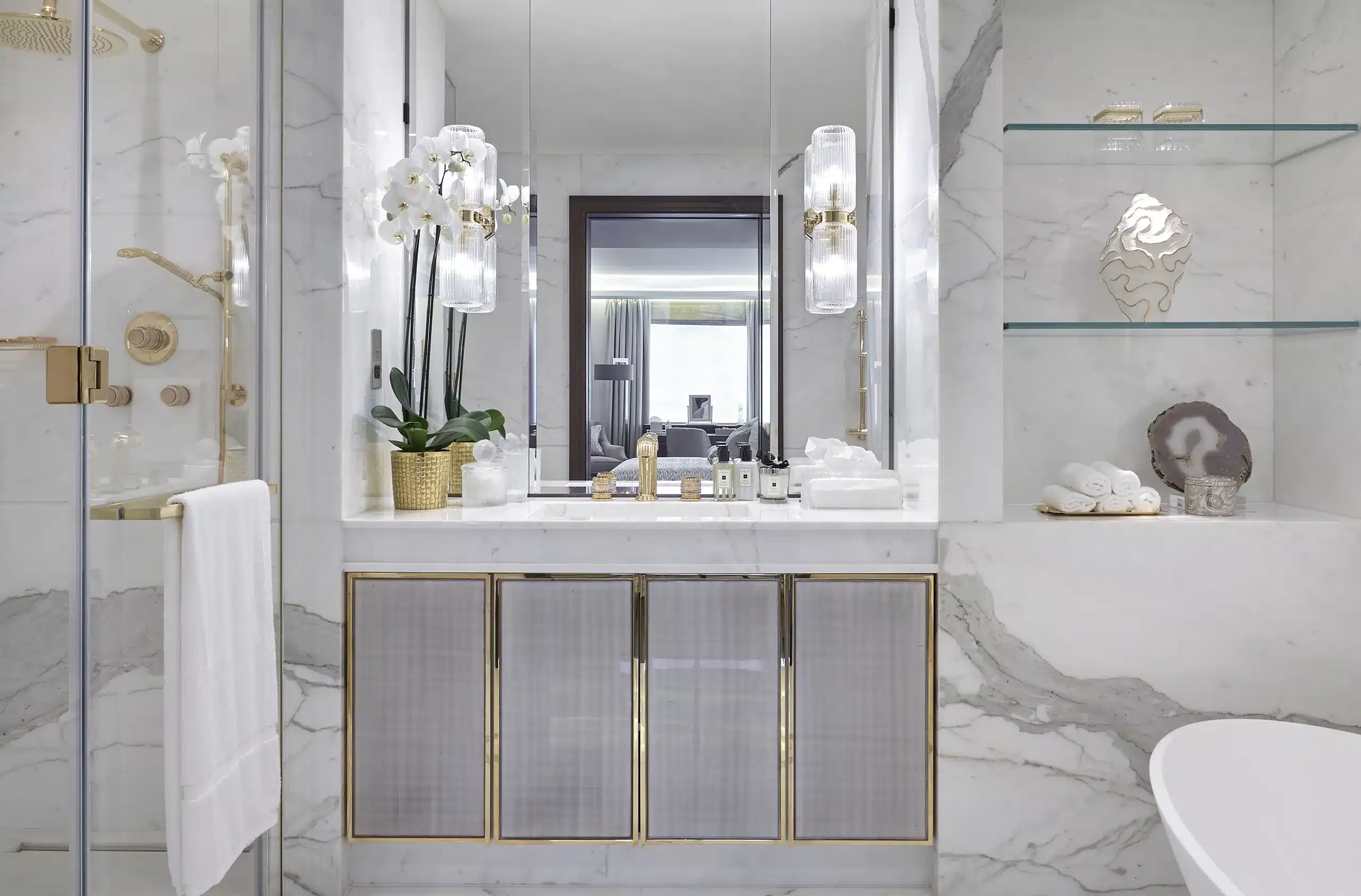 A bathroom with light marble in a hyde park townhouse in central london