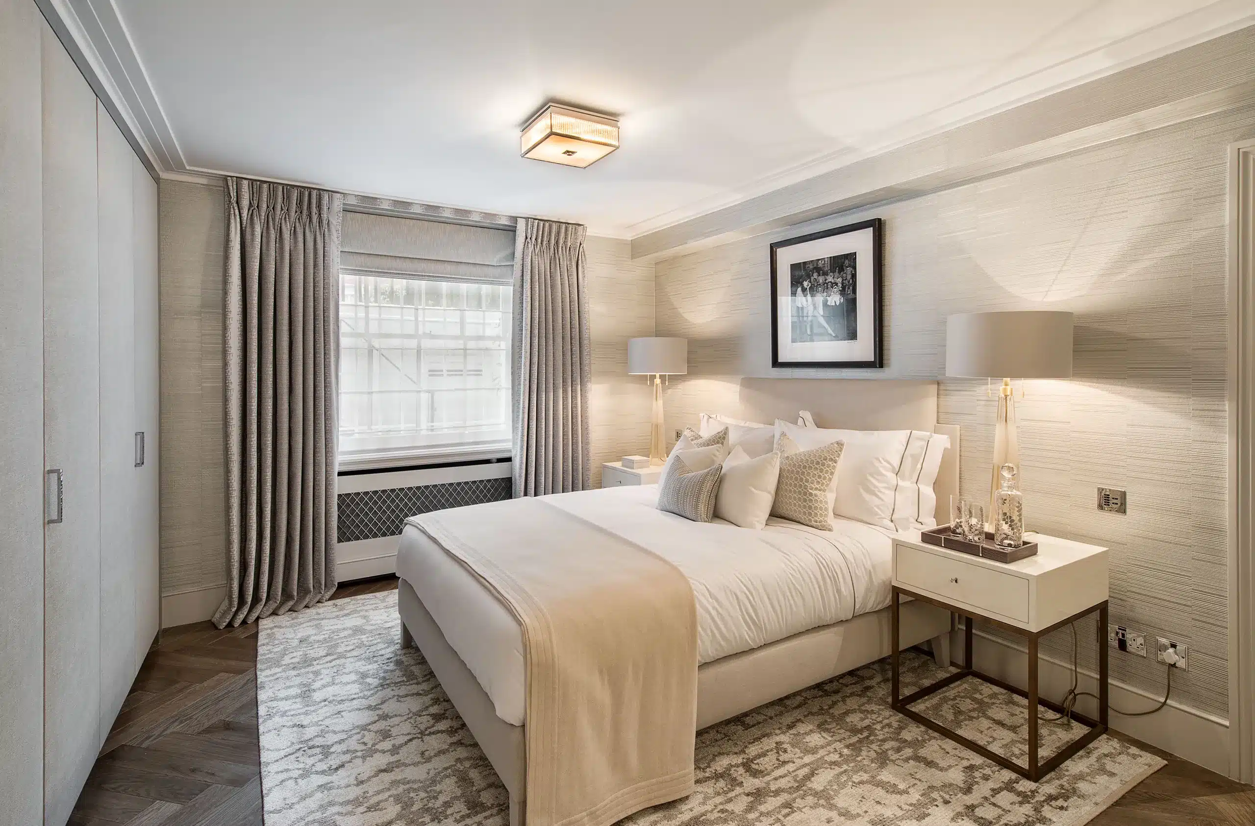 A luxury master bedroom done in contemporary neutral tones