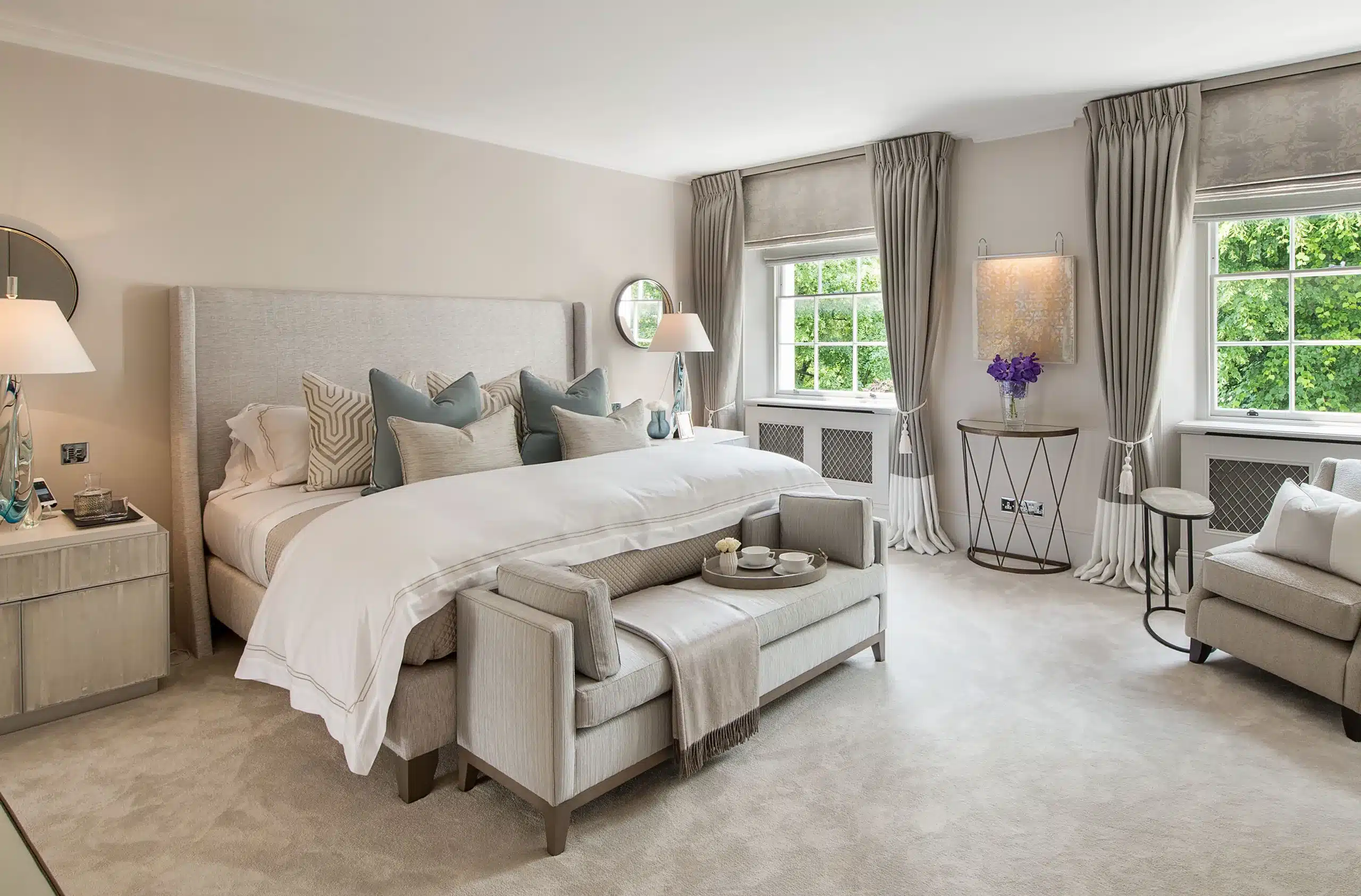 A luxury master bedroom done in contemporary neutral tones by interior design studio katharine pooley