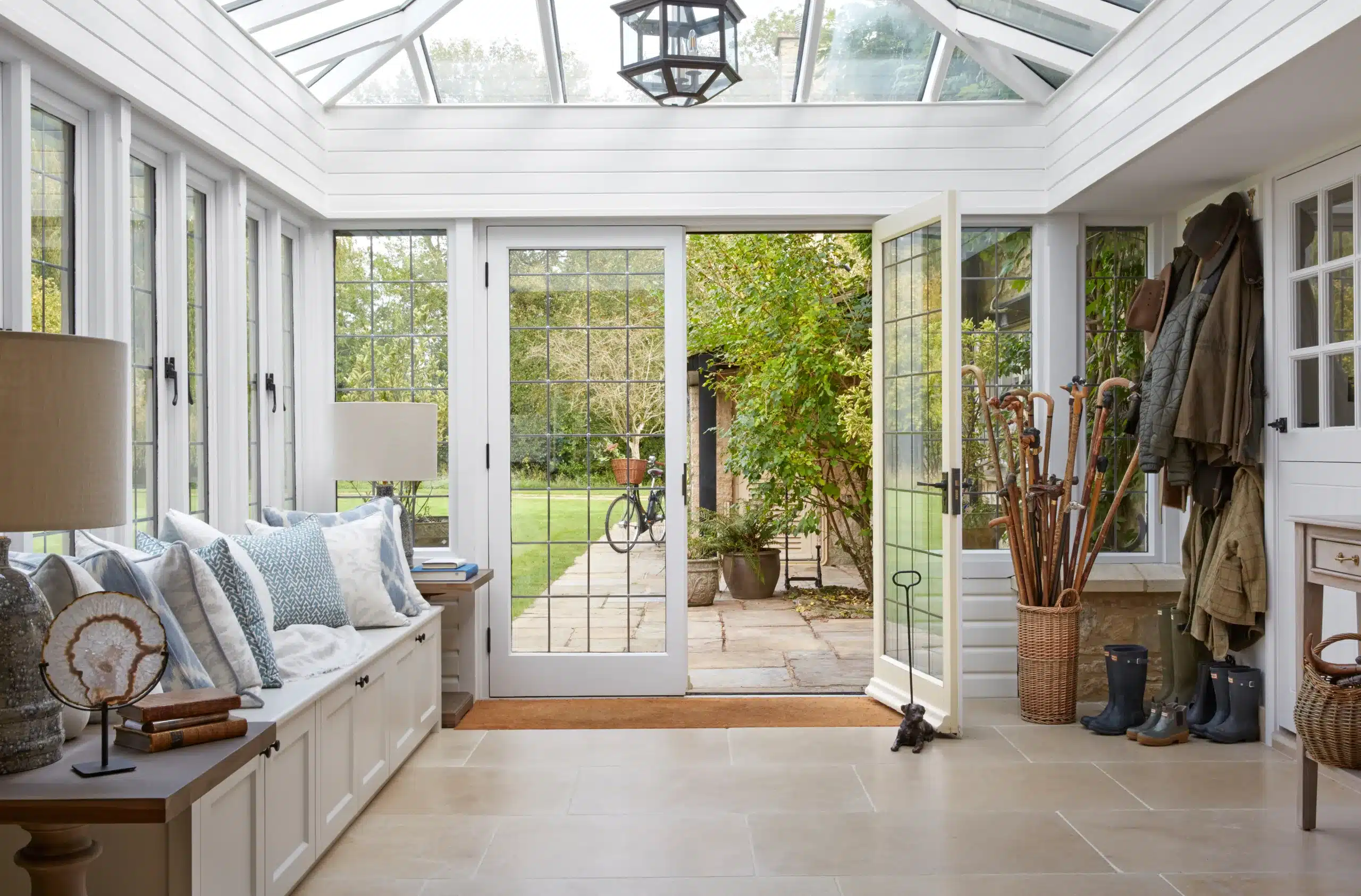 A conservatory in a converted mill house, a project from the UK's best interior designer Katharine Pooley