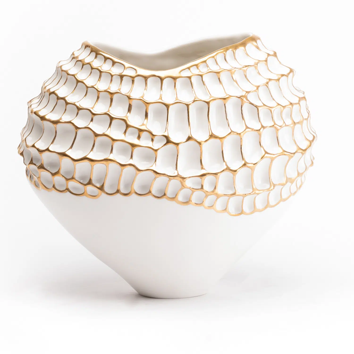 A porcelain vase with undulating shape and delicate gold details from the Katharine Pooley boutique