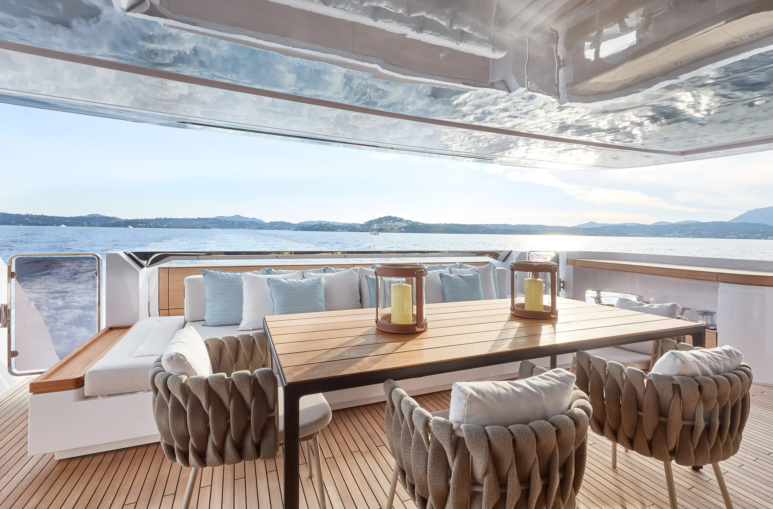 The aft deck looking out to sea as the superyacht Custom Line 106 is underway in the Med
