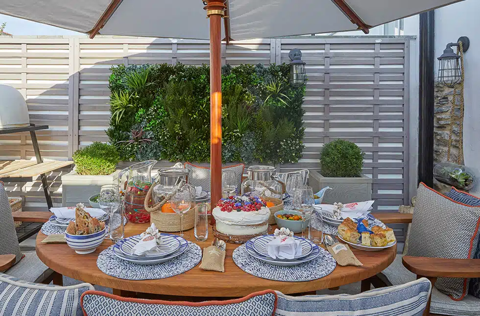 A table set with a summer spread in an outdoor setting