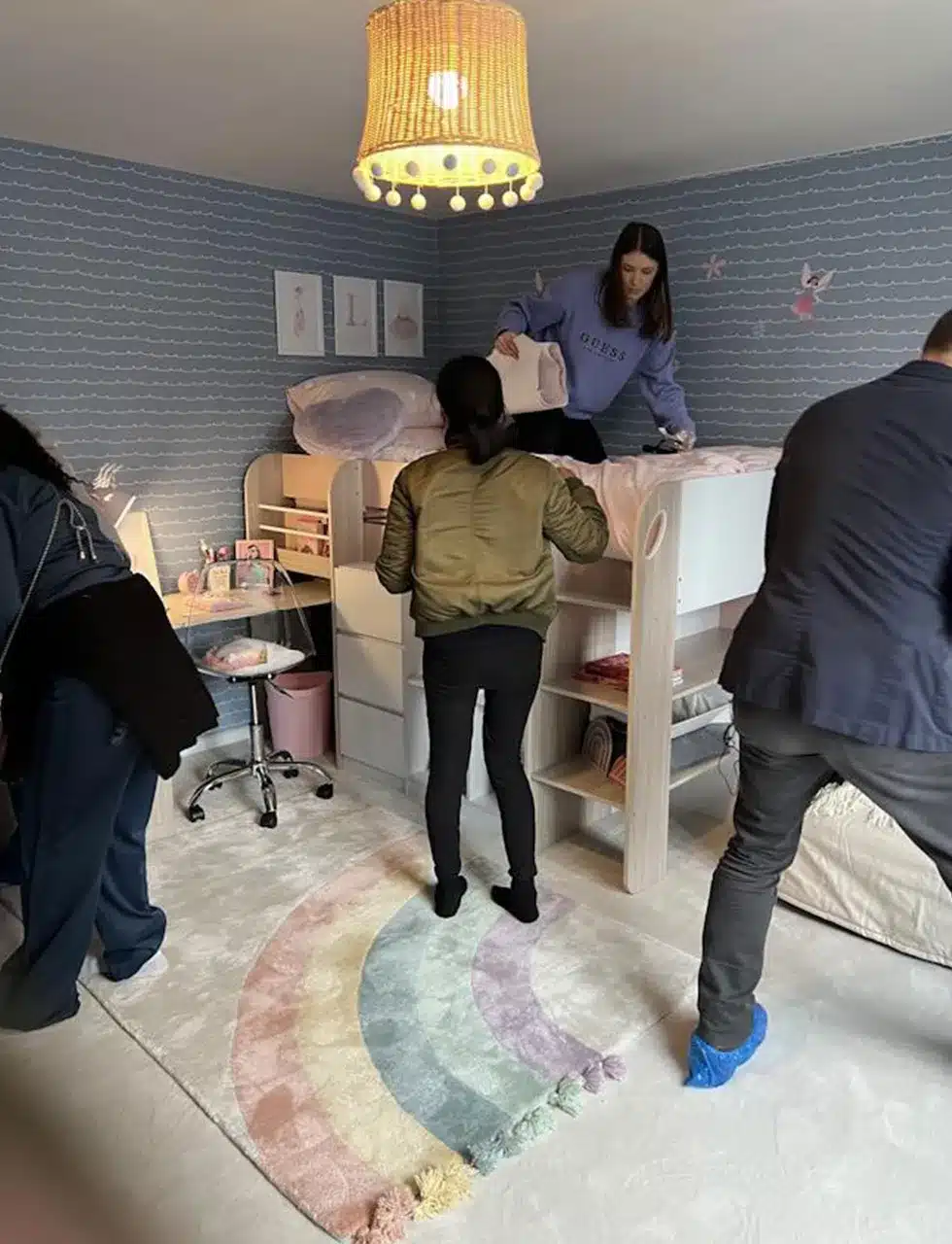 The team working on child's room designed by Katharine Pooleys interior design team, as part of charity project Decorate a Childs Life by The Childhood Trust
