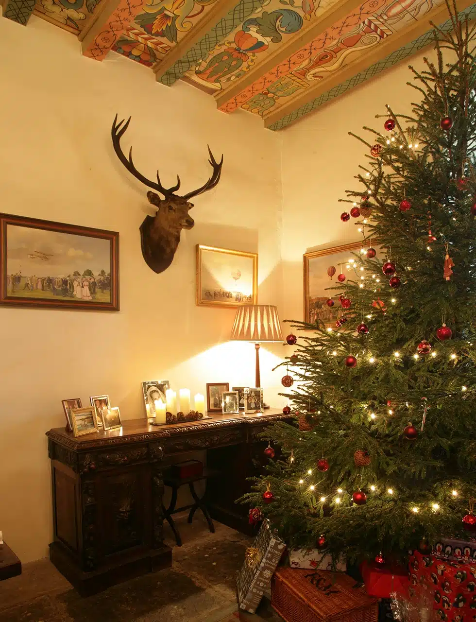 A Christmas tree setting in a Scottish highland castle as designed by katharine pooley