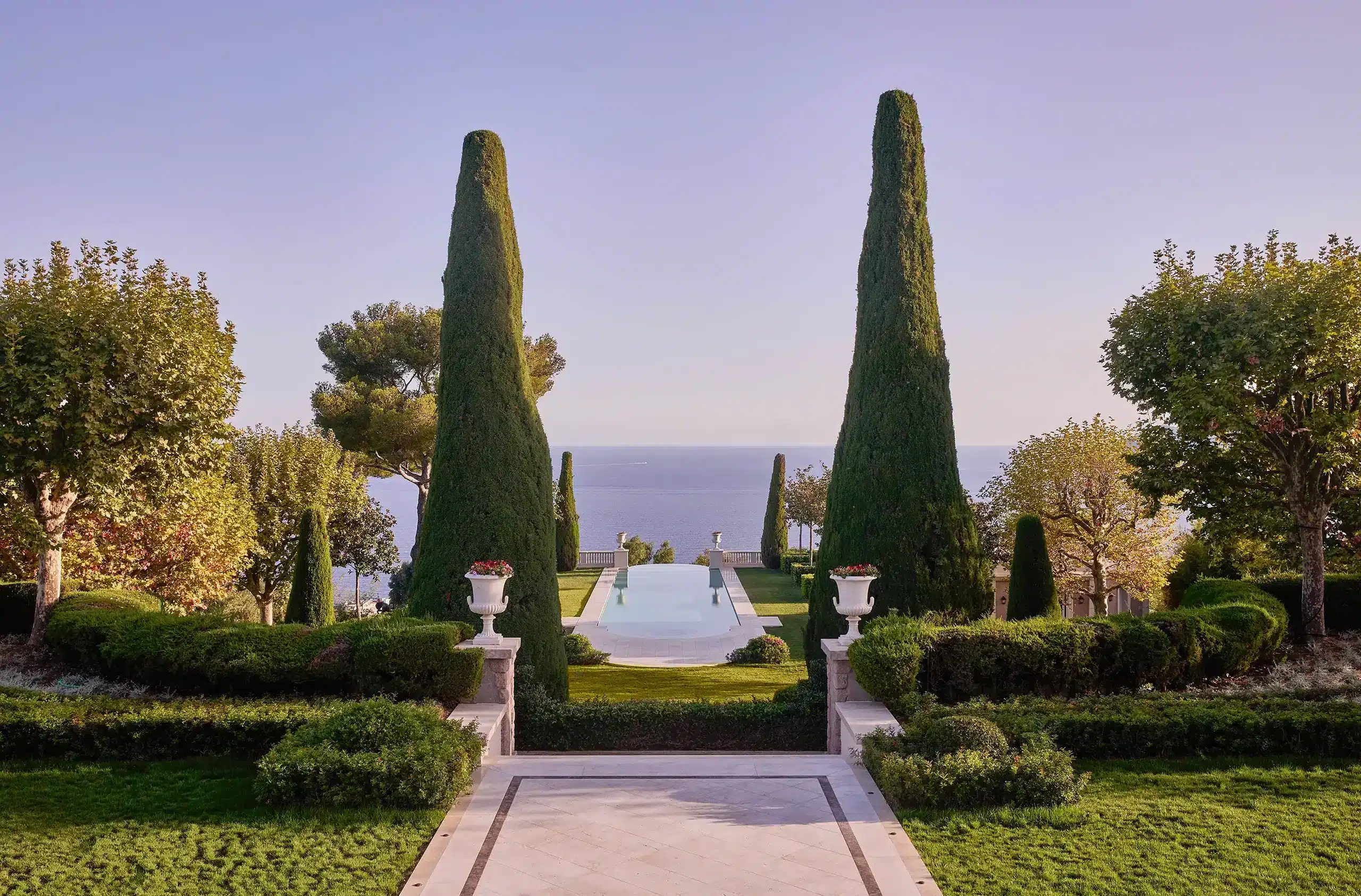 Outdoor pool and garden of Château de la Croix des Gardes with sea view