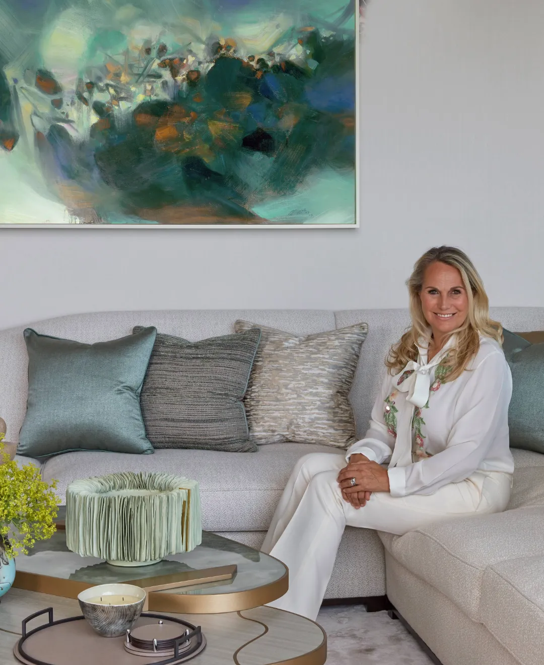 Worldwide luxury interior designer Katharine Pooley with a piece of contemporary art