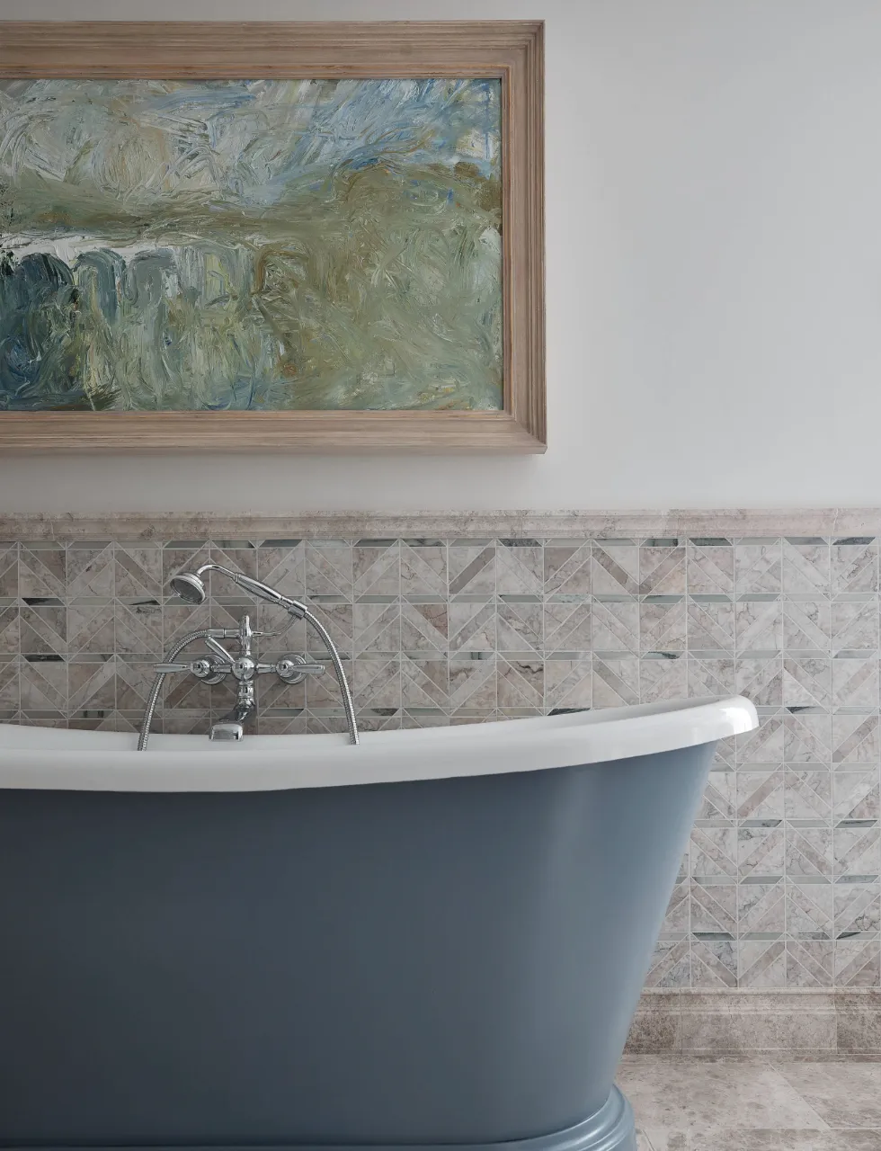 A deep bath tub giving perfect bathroom design inspo from its location in the Lake District