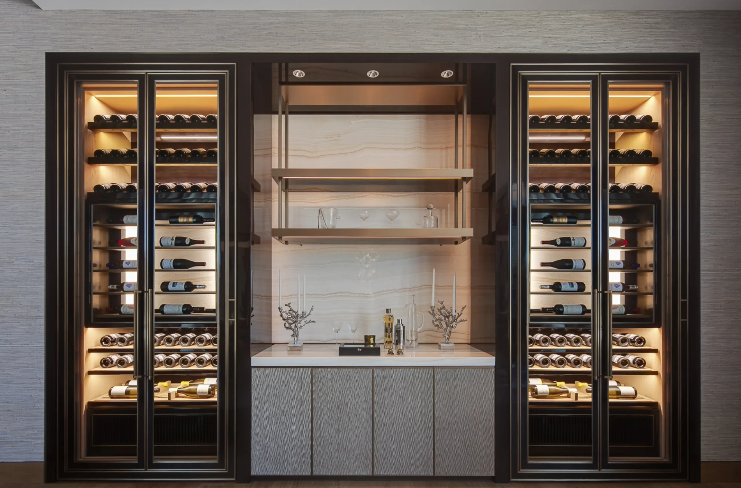A wine wall with wet bar in one of Katharine Pooleys luxury interior design projects