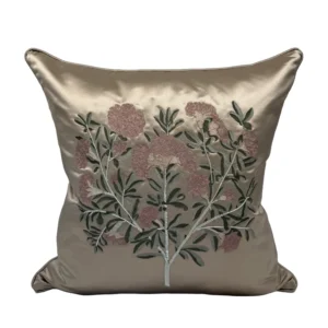 A beautiful champagne coloured silk emboirdered cushion by local London atelier Geraldine Larkin.
