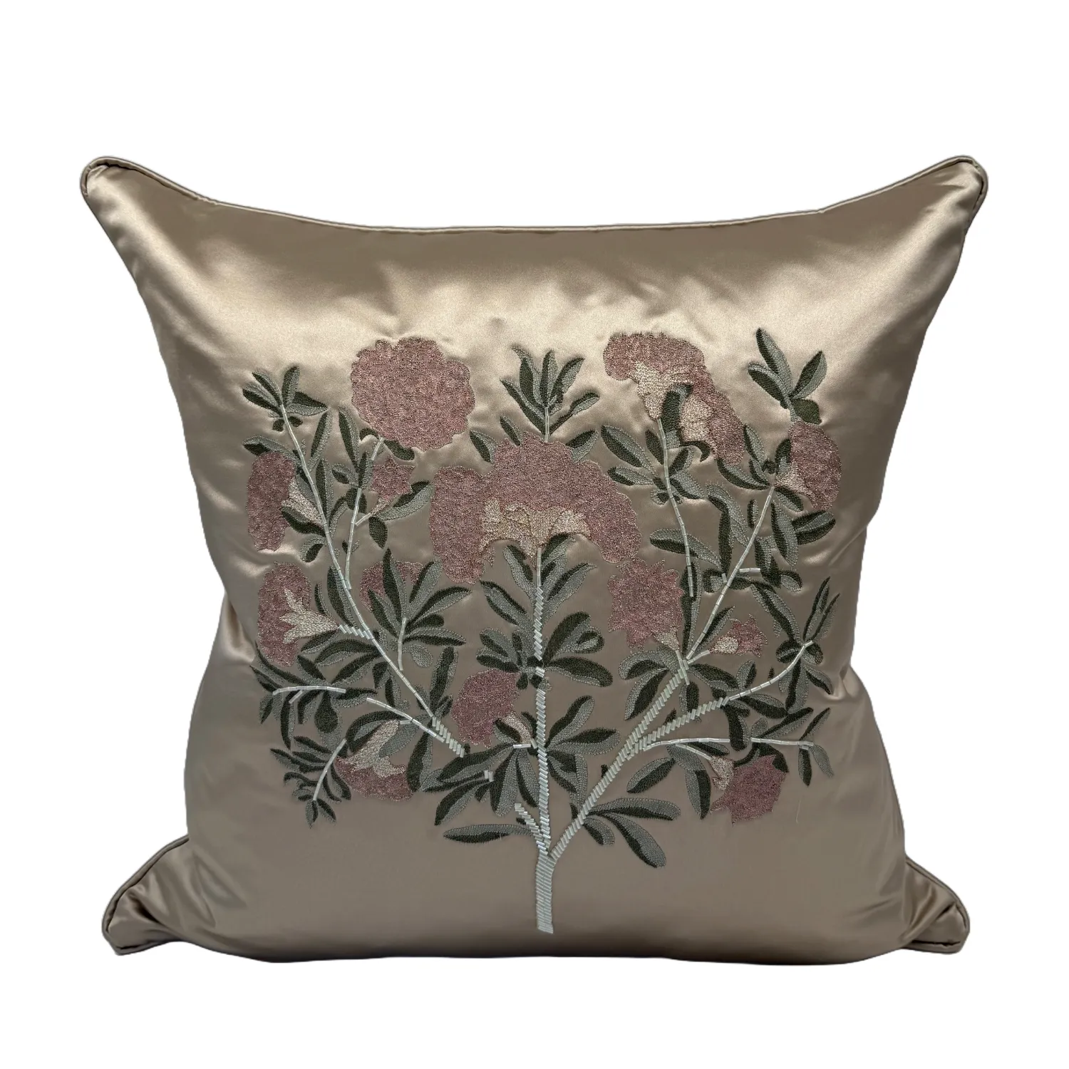 A beautiful champagne coloured silk emboirdered cushion by local London atelier Geraldine Larkin.